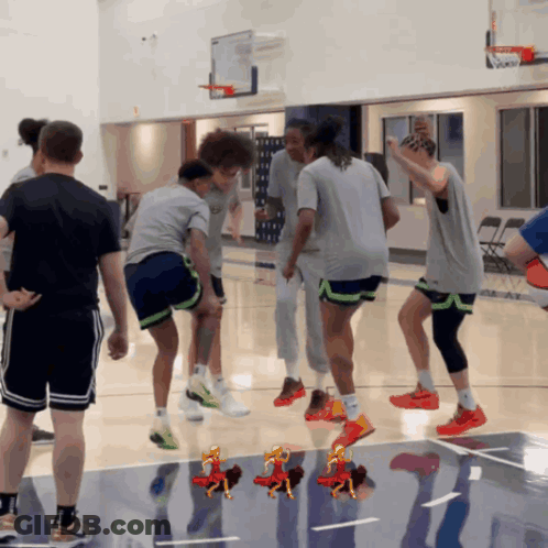Group Playing Basketball On Court GIF