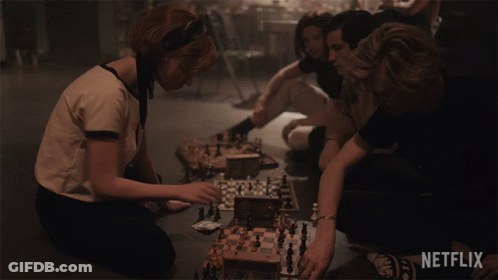 Group Playing Chess With Netflix Logo GIF