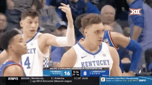 Group Playing Game In Front Of Louisville Sign GIF