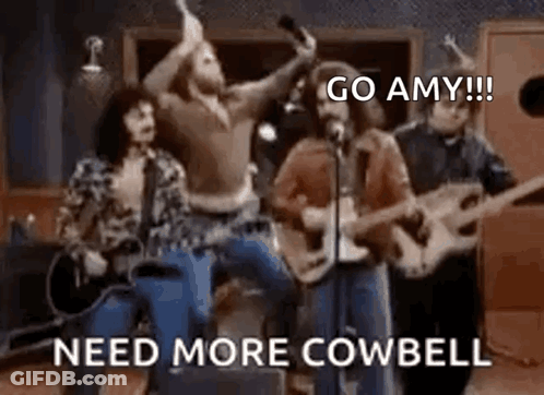 Group Playing Guitars And Singing Into Microphones GIF