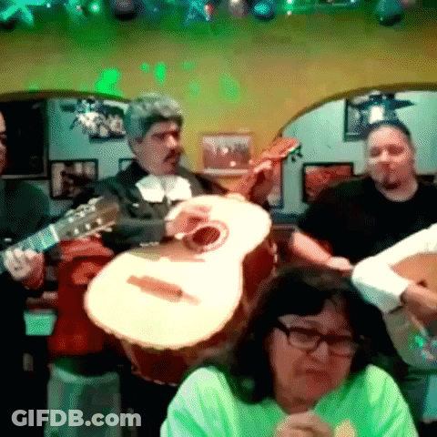 Group Playing Guitars Under Green Lights GIF
