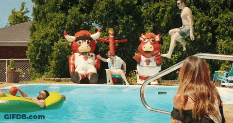 Group Playing In Pool With Bull Mascot GIF