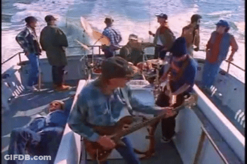 Group Playing Instruments On A Boat GIF
