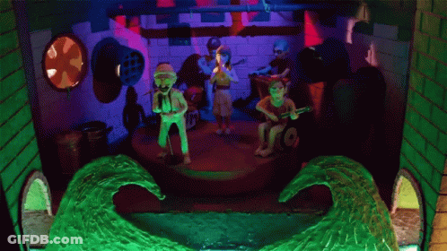 Group Playing Instruments On Stage With Wave GIF