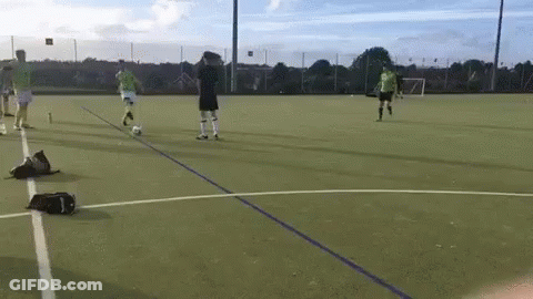 Group Playing Soccer On Field GIF