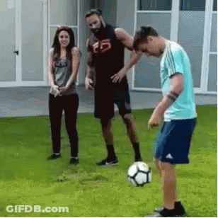 Group Playing Soccer On Lush Green Field GIF