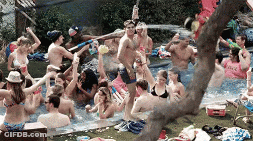Group Playing With Water Guns In Pool GIF