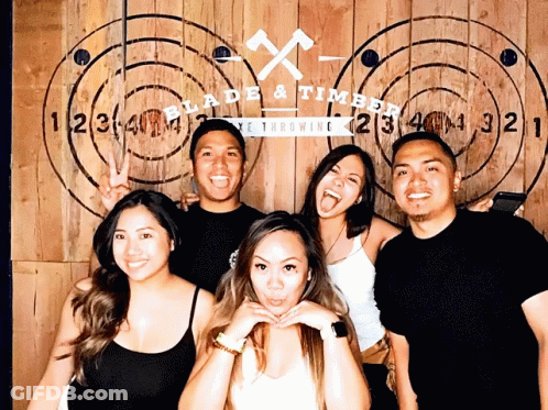 Group Posing At Blade & Timber Wall GIF