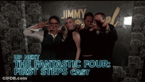 Group Posing In Front Of Jimmy Sign GIF