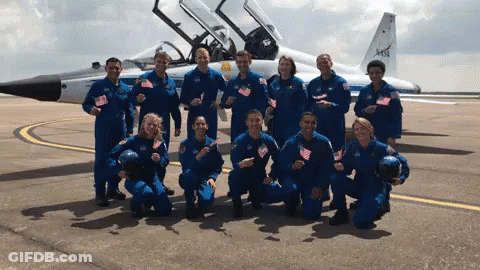Group Posing In Front Of NASA Airplane GIF