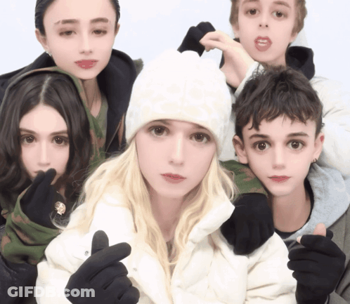 Group Posing With Girl In White Hat GIF
