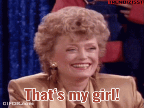 Group Posing With Nuestra Tele Logo GIF