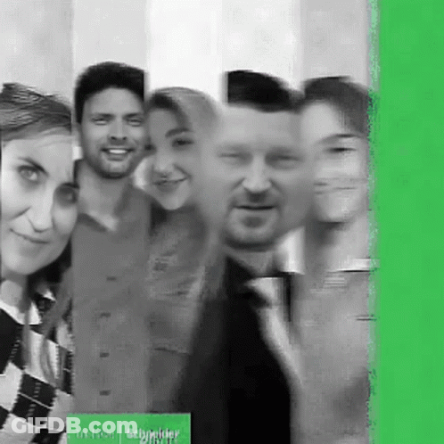 Group Posing With Schneider Sign GIF