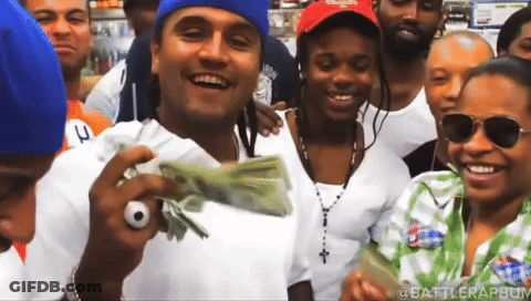 Group Posing With Stack Of Money GIF