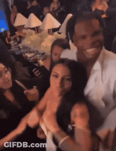 Group Posing With White Shirt Saying A GIF