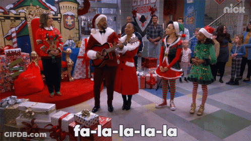 Group Singing Christmas Song With Nick Logo In Background GIF