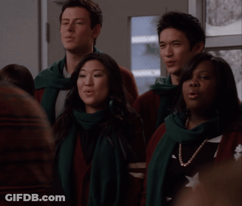 Group Singing In Scarves And Sweaters GIF