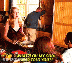 Group Sitting Around Table Asking What Oh My God Who Told You GIF
