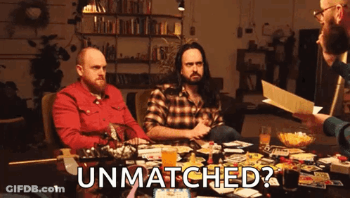 Group Sitting Around Table Playing Game Asking If Unmatched GIF
