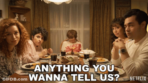 Group Sitting Around Table Saying Anything You Wanna Tell Us GIF