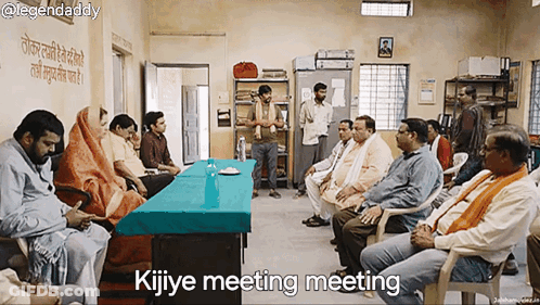 Group Sitting Around Table Saying Kijiye Meeting Meeting GIF