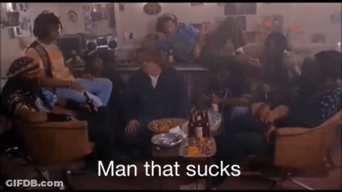 Group Sitting Around Table Saying Man That Sucks GIF