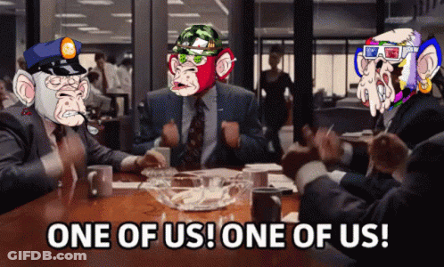 Group Sitting Around Table Saying One Of Us One Of Us GIF