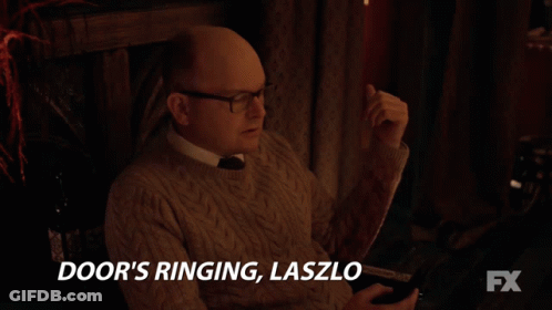 Group Sitting Around Table Saying You Gotta Go And Answer The Darn Tootin Door Fx GIF