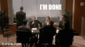Group Sitting Around Table With I'm Done On Wall GIF