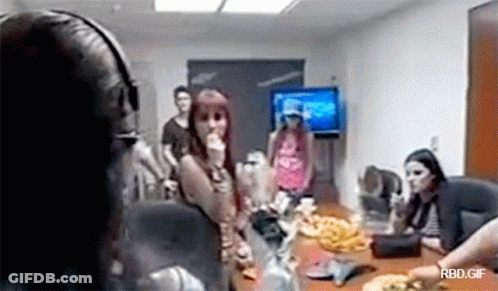 Group Sitting Around Table With TV GIF