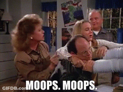 Group Sitting Around Table Woman Holding Man's Arm GIF