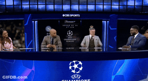 Group Sitting At Champions League Logo GIF