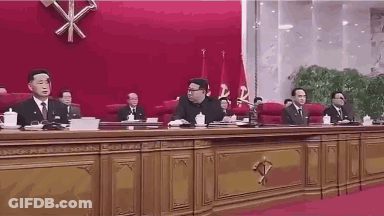 Group Sitting At Long Table GIF