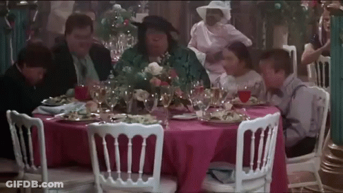 Group Sitting At Pink Tablecloth With Wine GIF