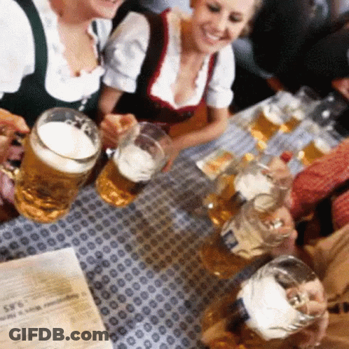 Group Sitting At Table Holding Beer Mugs GIF