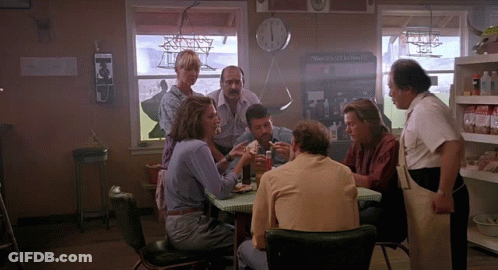 Group Sitting At Table In Front Of Clock Saying The Valley School GIF