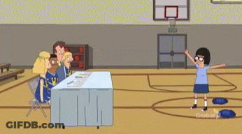 Group Sitting At Table In Gym GIF