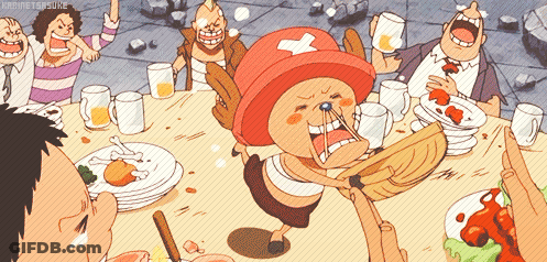 Group Sitting At Table With Cartoon Character In Red Hat With Cross GIF