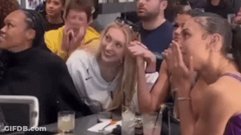 Group Sitting At Table With Drinks GIF