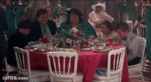 Group Sitting At Table With Food And Wine GIF