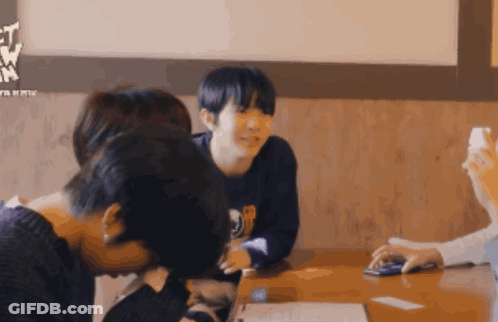 Group Sitting At Table With Lets Go Sign GIF
