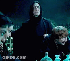 Group Sitting At Table With Man In Black Cape And Bottles GIF