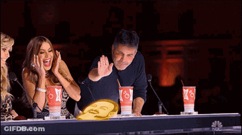 Group Sitting At Table With NBC Cups GIF