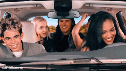 Group Sitting In Car With Rear View Mirror GIF