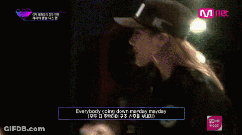 Group Sitting In Front Of Mnet Sign GIF