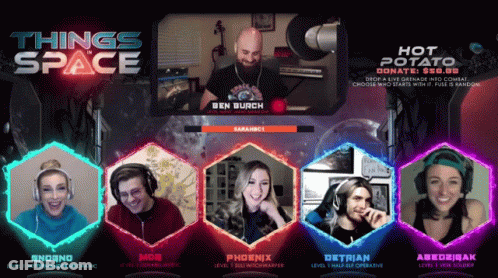 Group Sitting In Front Of Space Sign GIF