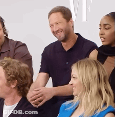 Group Sitting In Front Of Wall With VF GIF