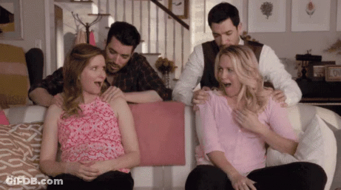 Group Sitting On Couch Holding Pregnant Woman GIF