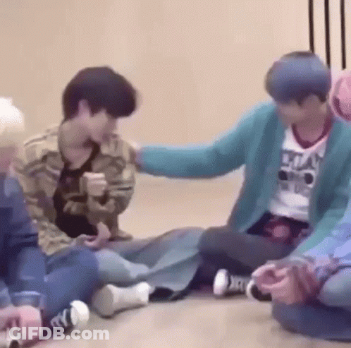 Group Sitting On Floor Petting Head GIF