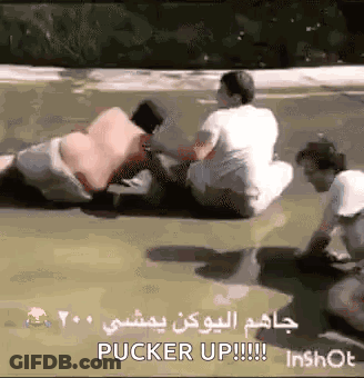 Group Sitting On Ground Pucker Up GIF